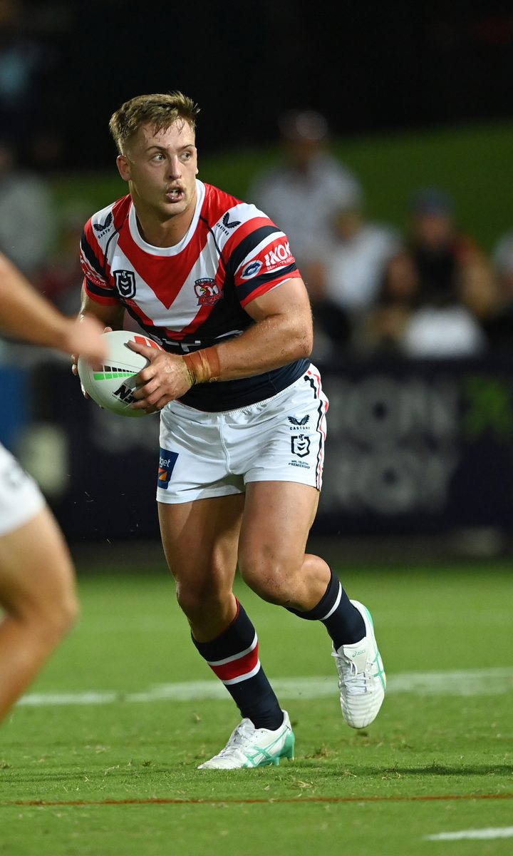 Professional rugby league player carrying the ball in match play